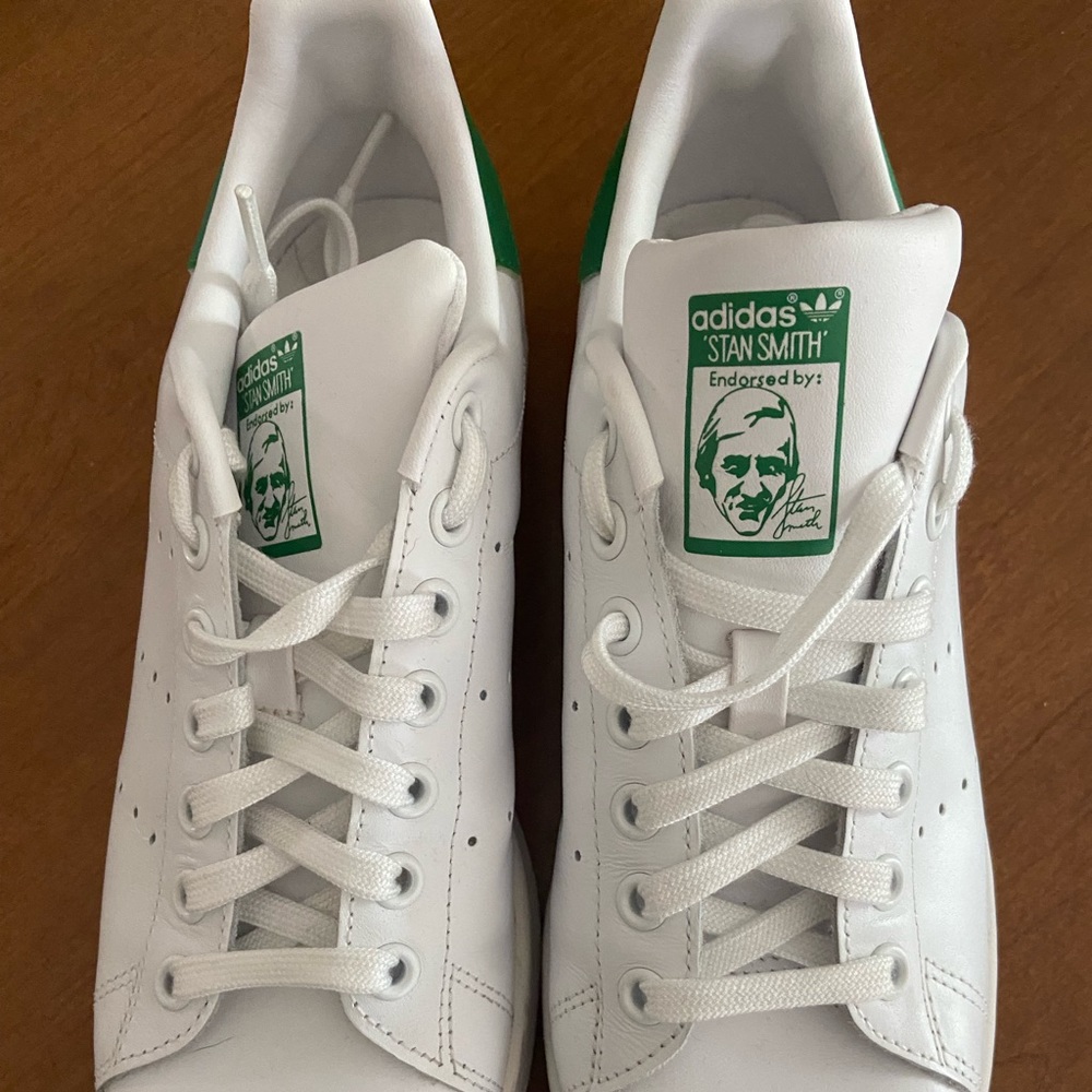 Womens green and white Stan Smith Adidas.